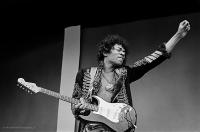 Jimi Hendrix with his arm in the air soundcheck Monterey Pop Festival, 1967 by Jim Marshall